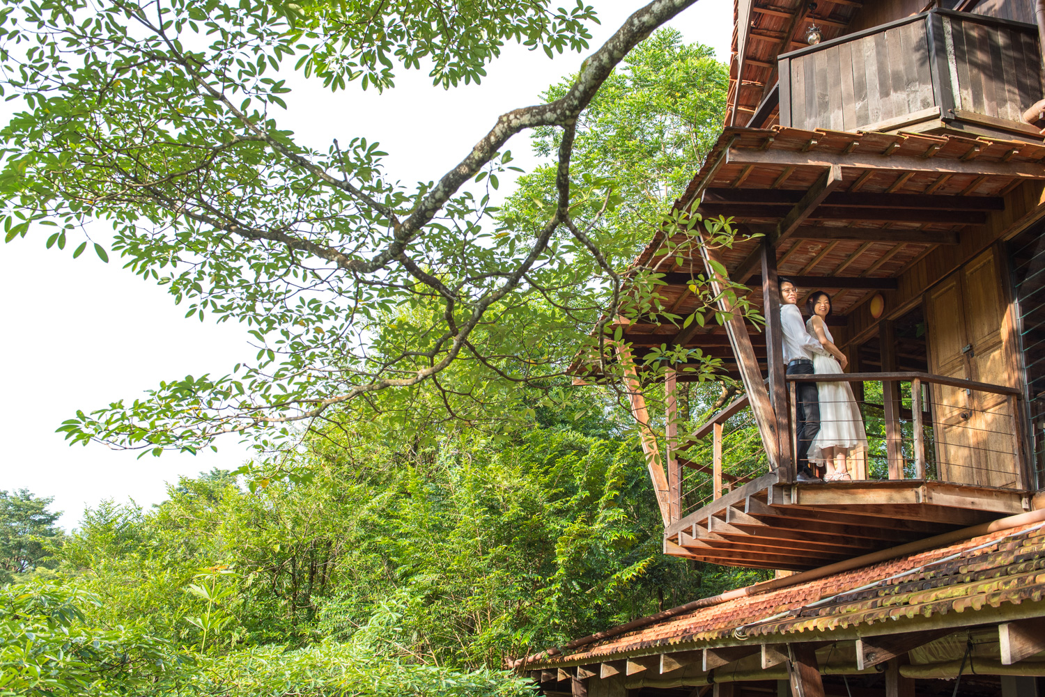 Guests on the balcony of SpyderHill's forest treehouse in Negeri Sembilan